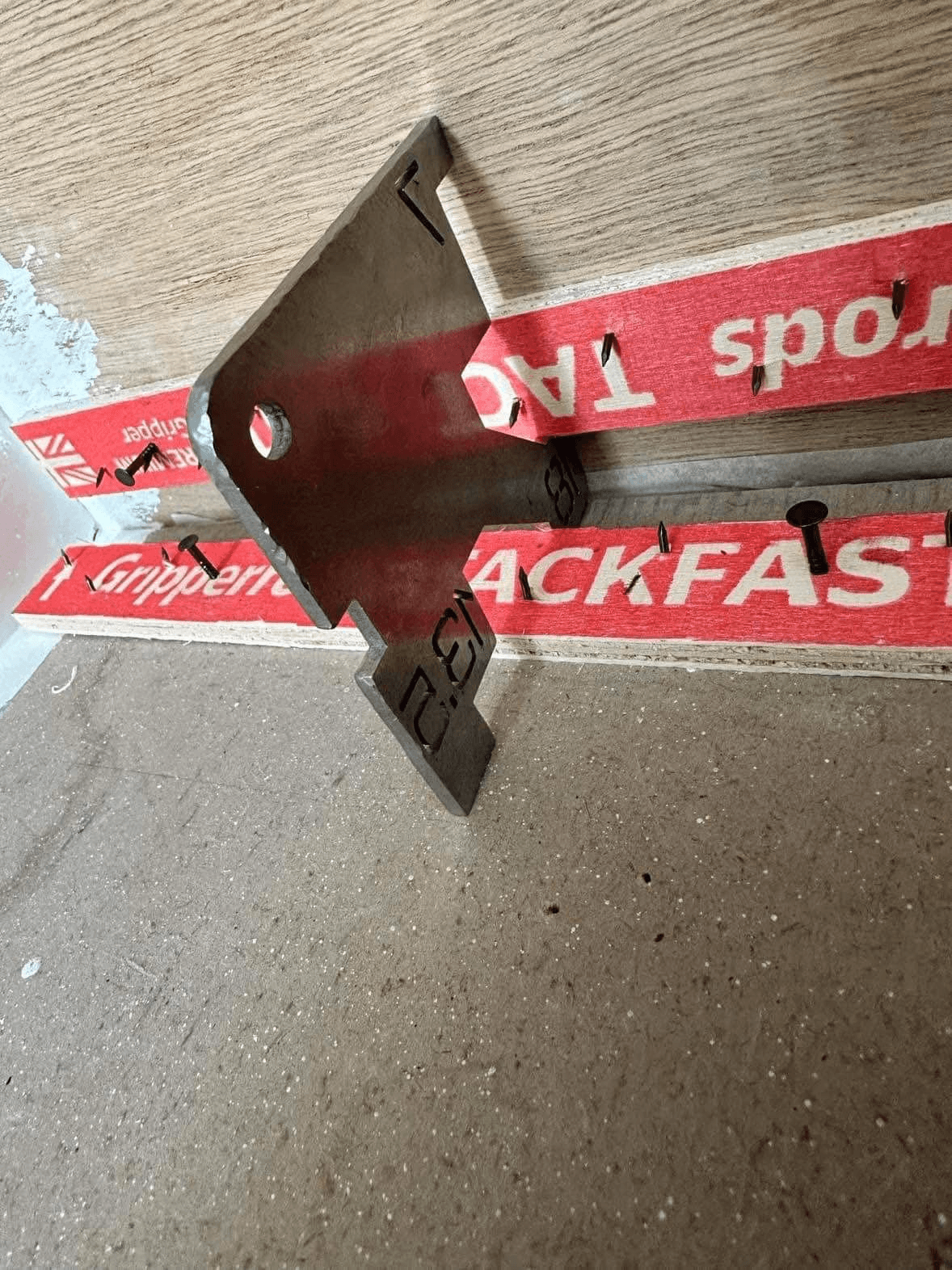 Close-up of professional gripper rod installation showing precision fitting technique